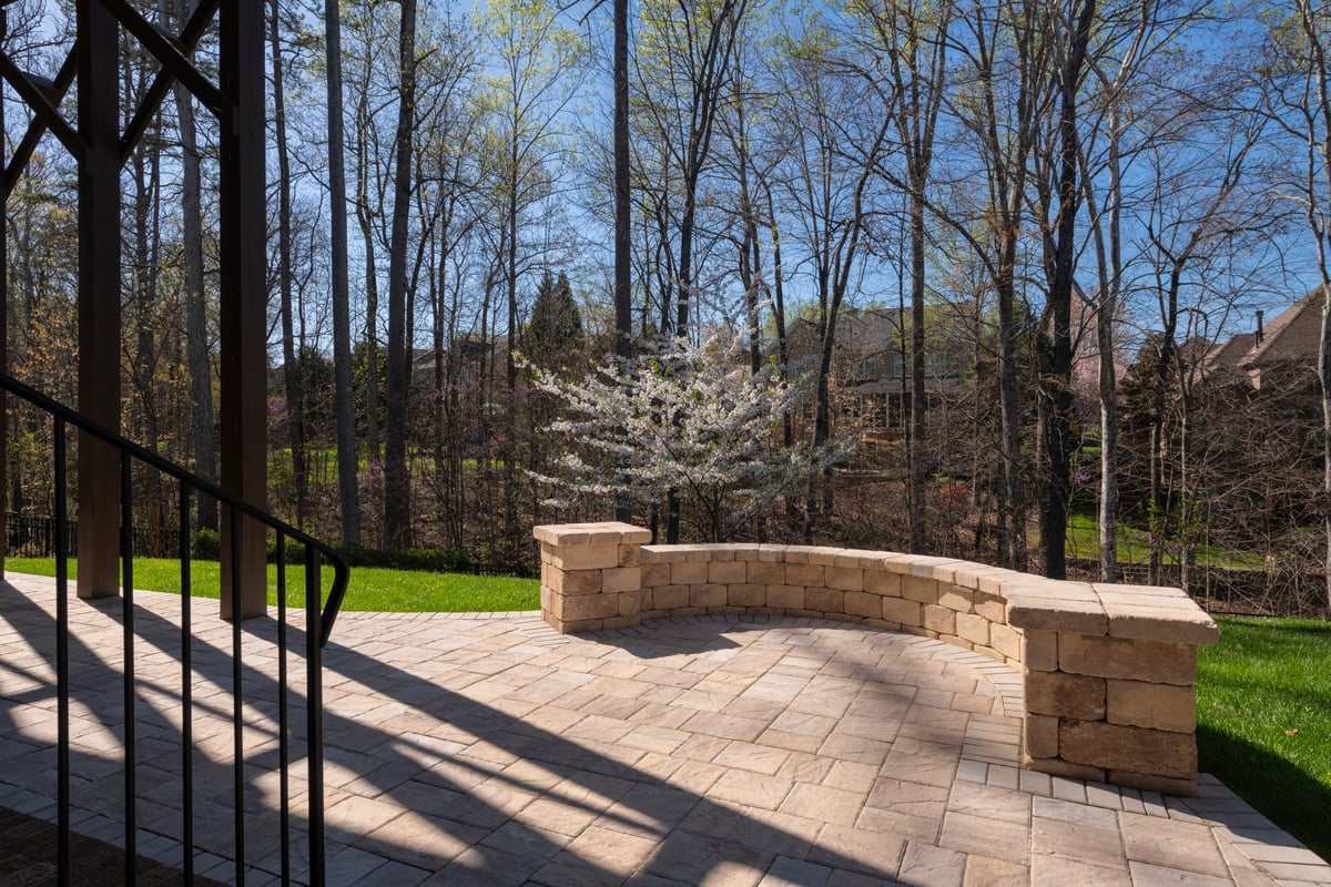 Backyard patio with stone wall and fresh hardscaping